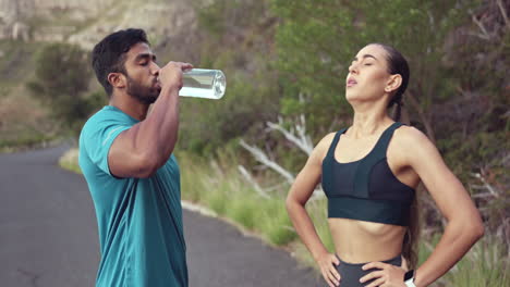 fitness, man and woman on break drinking water