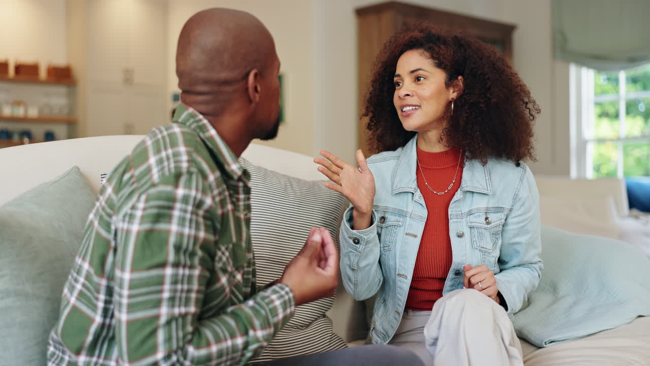 Couple having a conversation in their living room