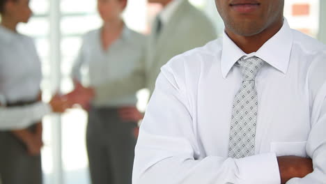 Business-man-folding-his-arms-as-the-camera-moves-up