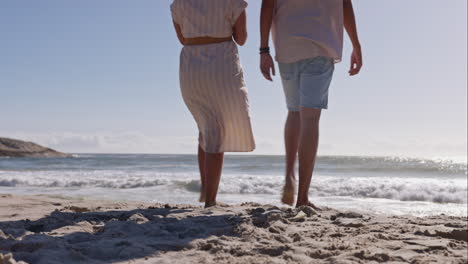 love, travel and couple walking on the beach