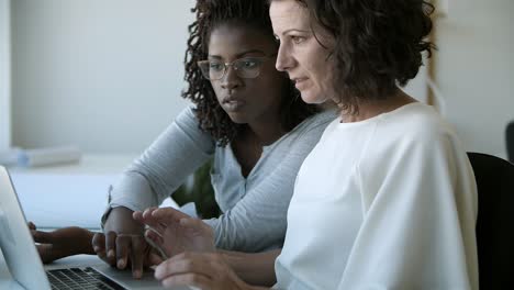 thoughtful ladies discussing some work issues.