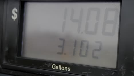 Gas-station-pump-screen-filling-up-and-pumping-slowly-from-13-dollars-to-20-bucks-and-less-than-5-gallons