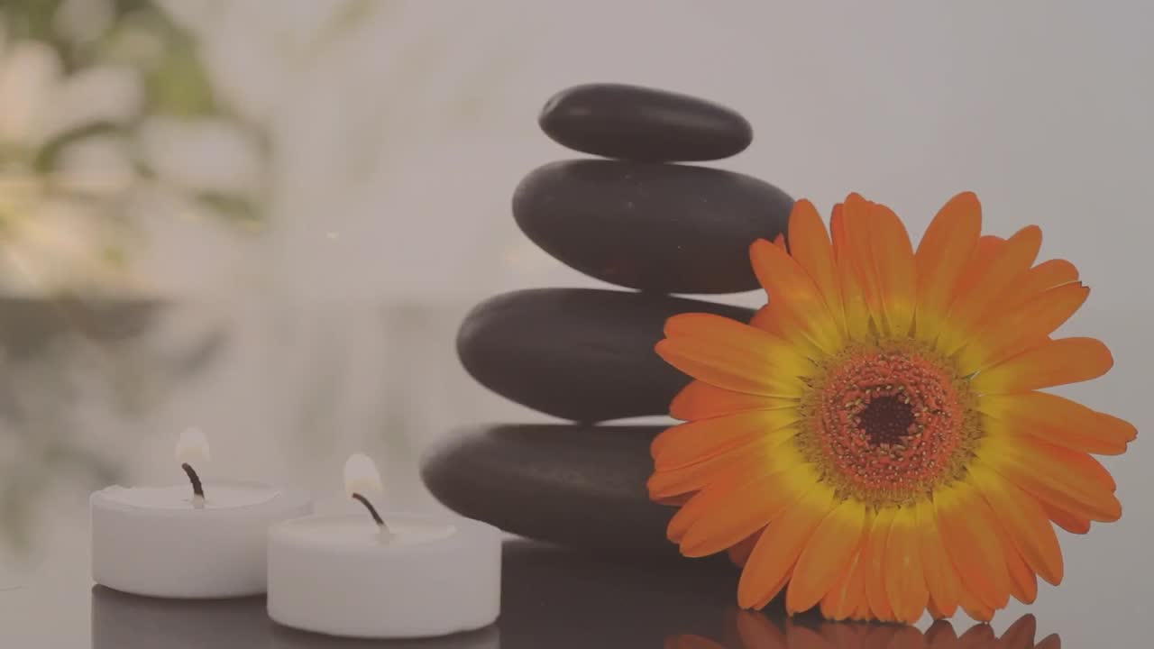Animation af stearinlys, blomst og massagesten