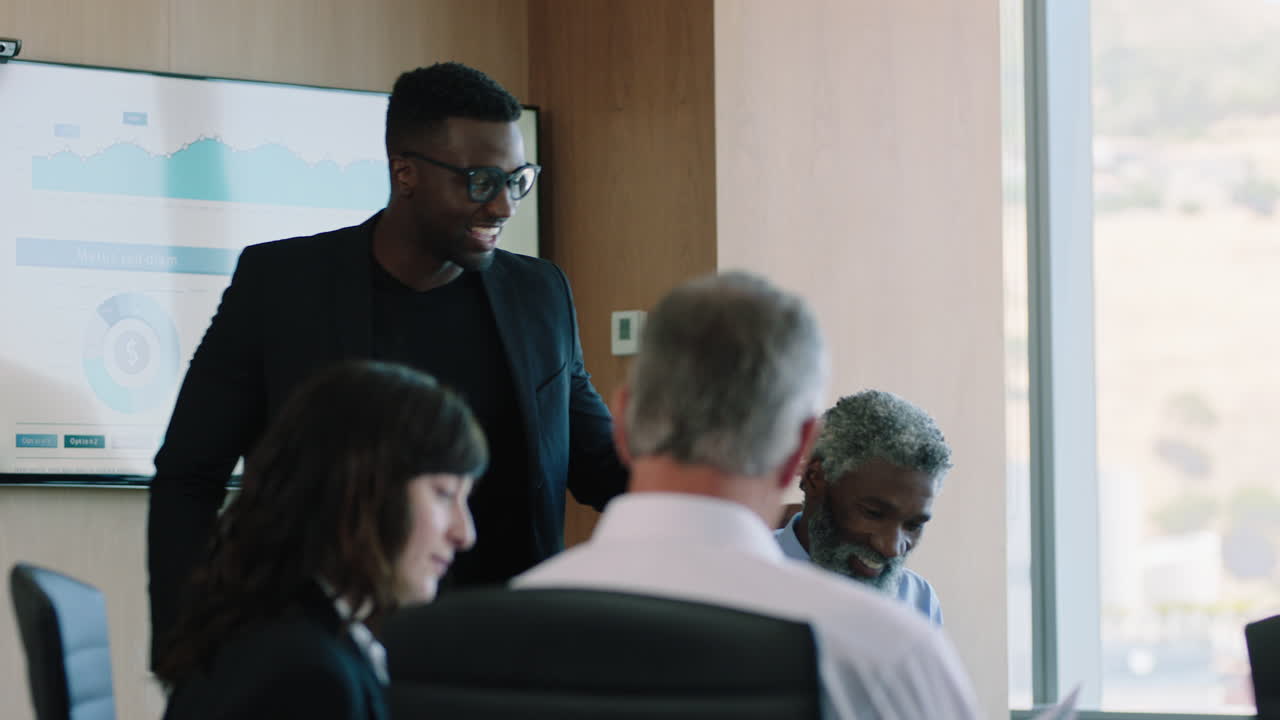 diverse business people meeting shaking hands in boardroom african american businessman preparing for conference chatting with clients shareholders planning partnership deal in corporate office