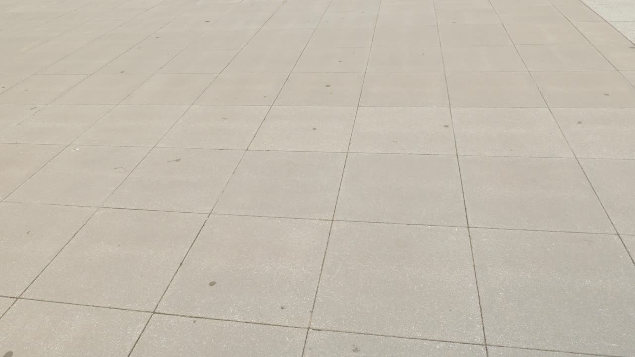 Distant view of Washington monument obelisk and tourists on National Mall in Washington, D.C., pan up reveal
