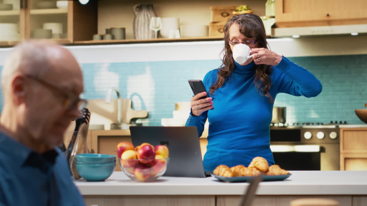 Portrait of older woman in home kitchen showcasing relaxed candid moment