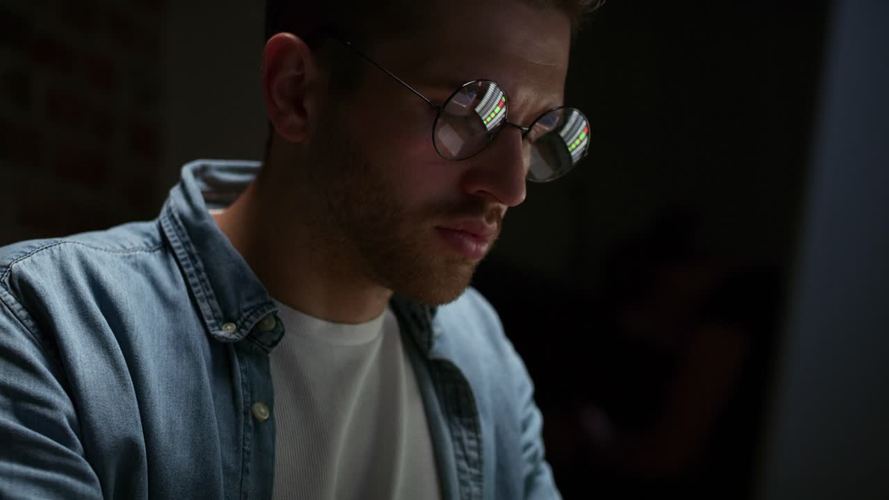 Adult man working late at home office