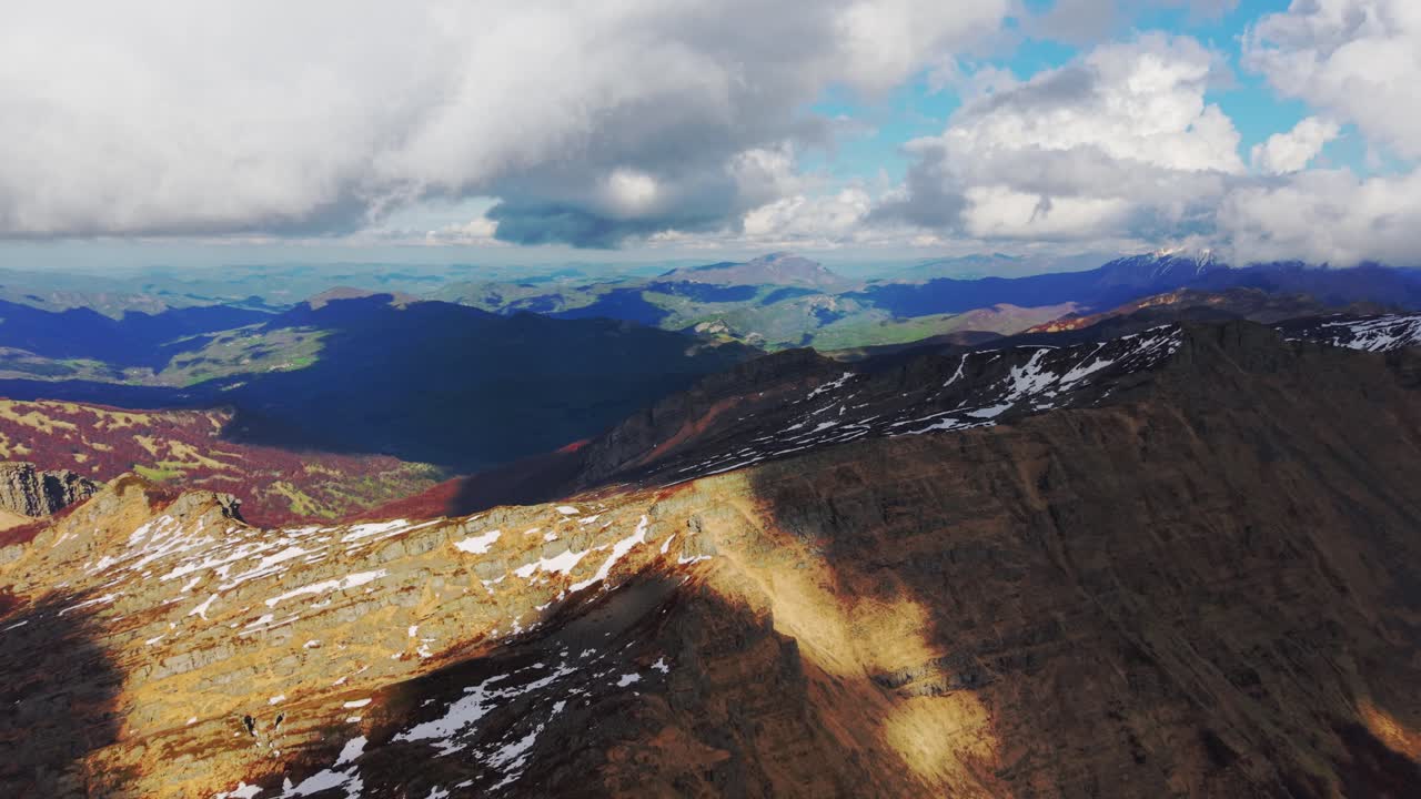 Stunning aerial view of rocky peaks and lush valleys in the Dolomites Mountains, Italy