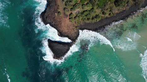 bird's eye view over fingal head causeway in fingal headland, nsw, australia - drone shot