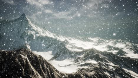 heavy snowing, focused on the snowflakes, mountains in the background