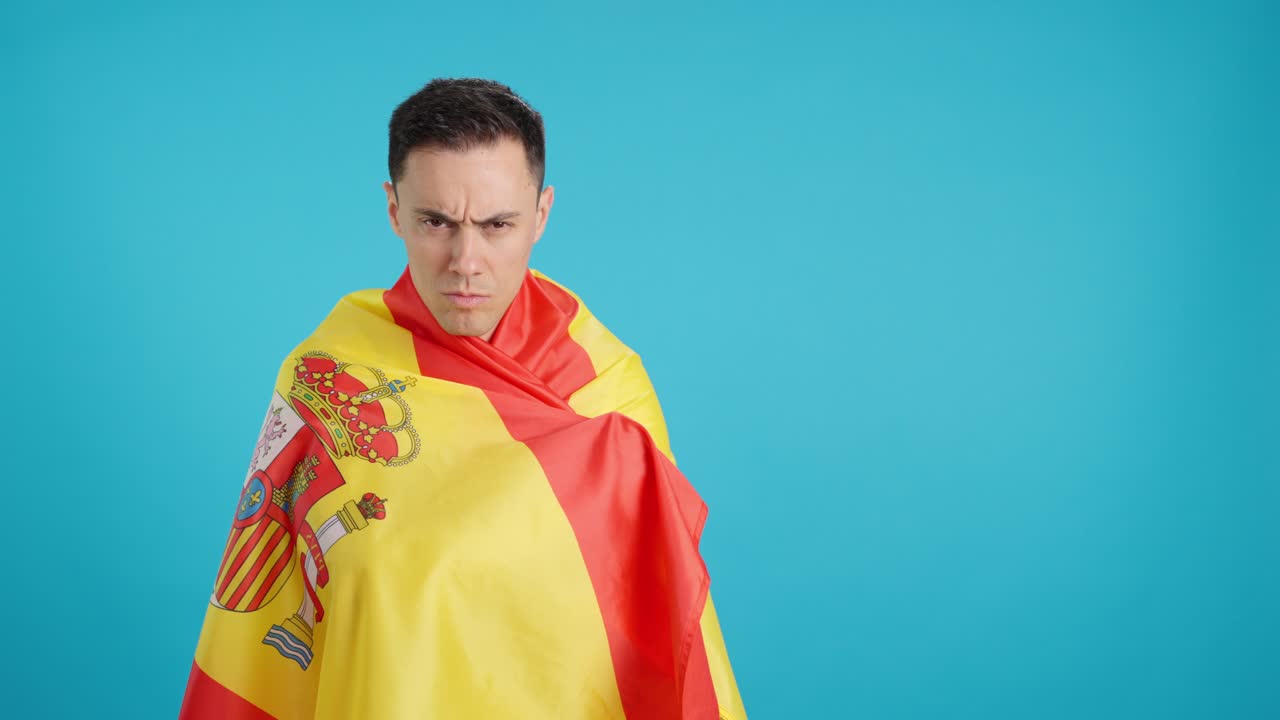 Man draped in Spanish flag