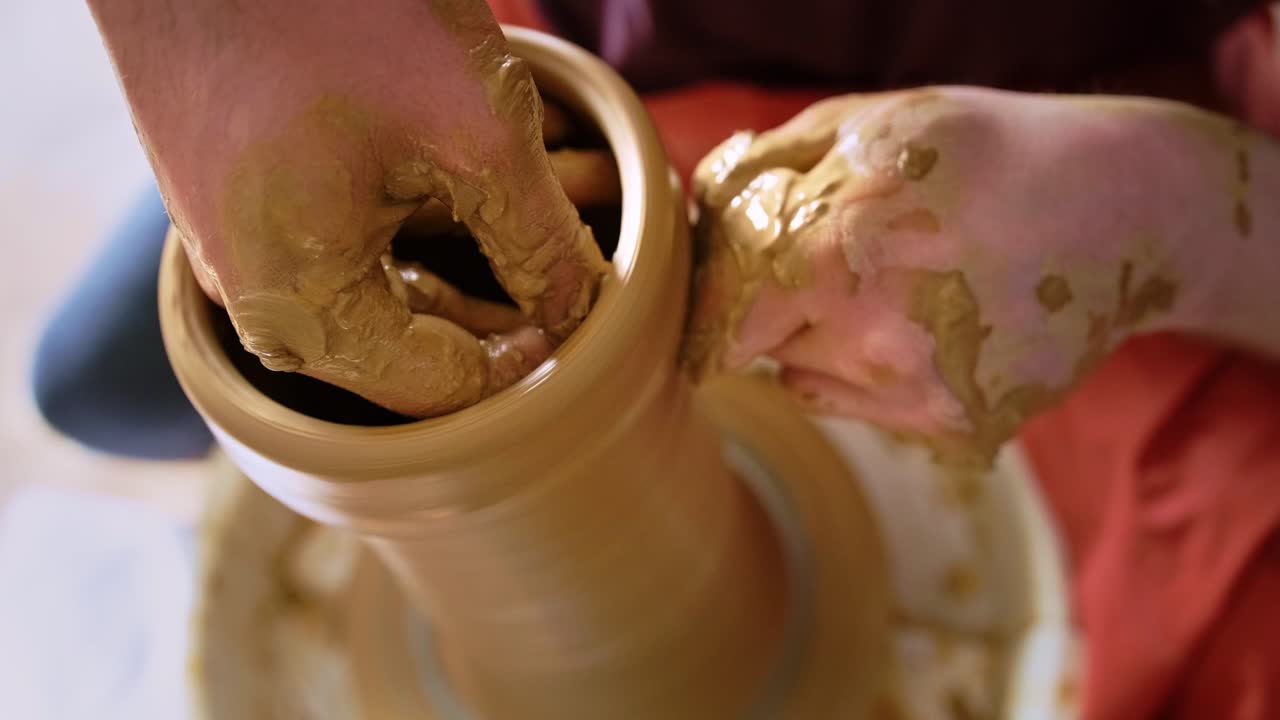 Crafting Elegance: The Art of Pottery Shaping with Hands Through the Stages of Creation from Clay to Finished Vessel in a Serene Studio Environment