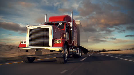 red semi-truck driving on a highway at sunset