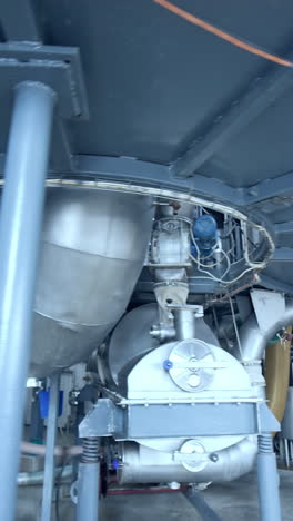 modern technology of milk producing factory. stainless diary industrial equipment. vertical video