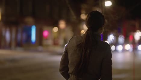 Happy-Woman-On-Blurry-City-Landscape-During-Night-In-Coaticook-Downtown,-Quebec-Canada,-Medium-Shot,-Slow-Motion