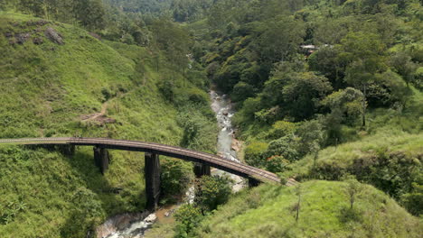 establishing aerial drone shot of demodara iron bridge in sri lanka on sunny day