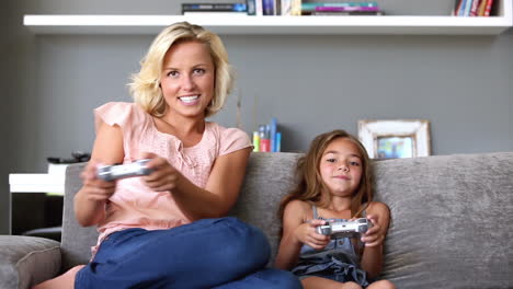 mother and daughter playing video games