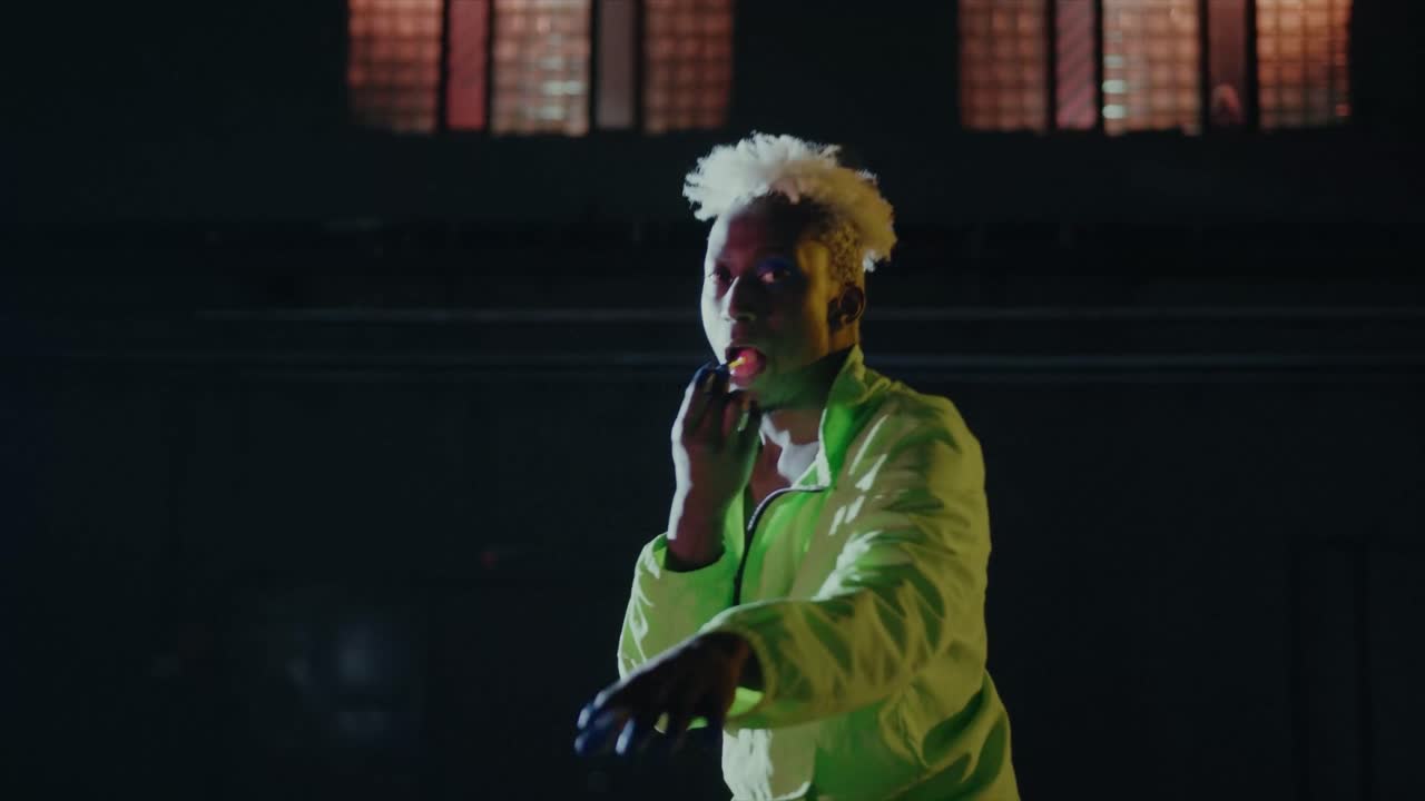 People dancing in unique lighting and abstract design