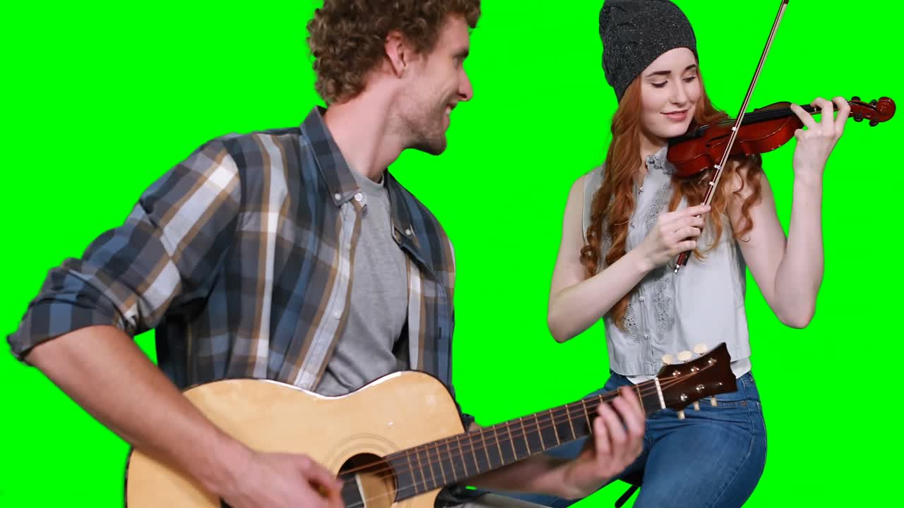 기타 와 바이올린 을 연주 하는 음악가