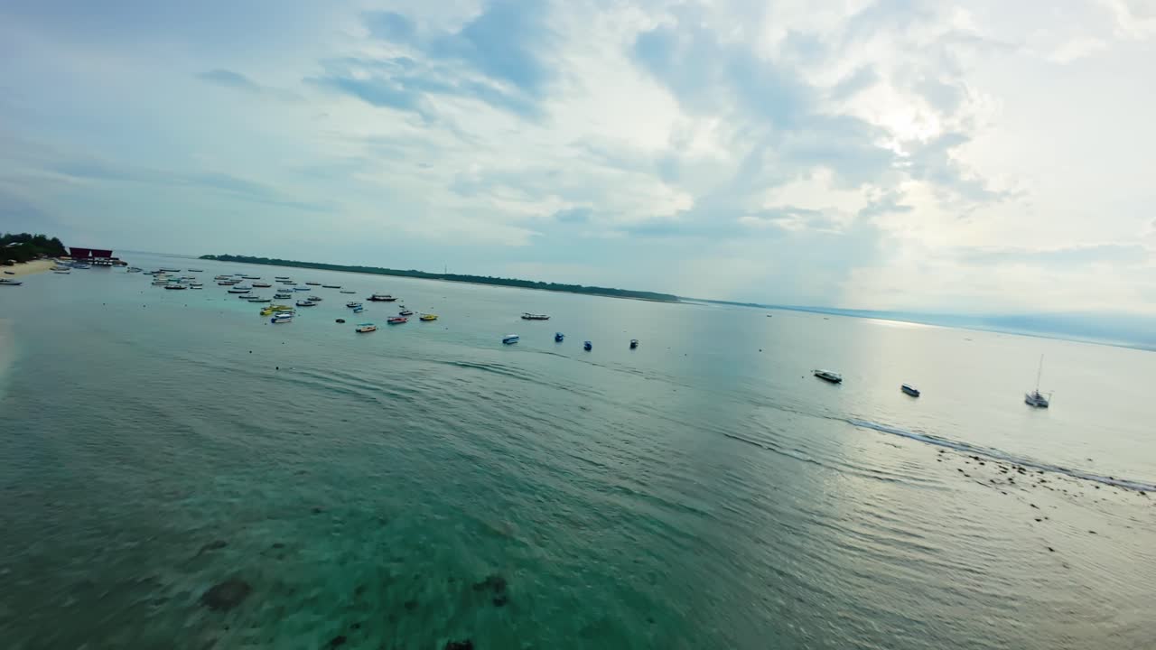 Gili Trawangan island beach FPV aerial at dawn, Indonesia