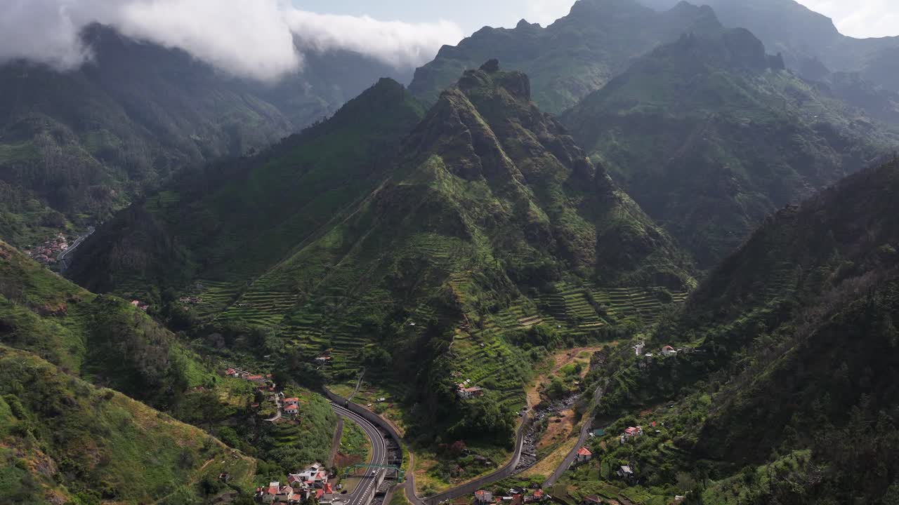 Village of Serra de Agua with dramatic mountains and terraced farm fields, drone