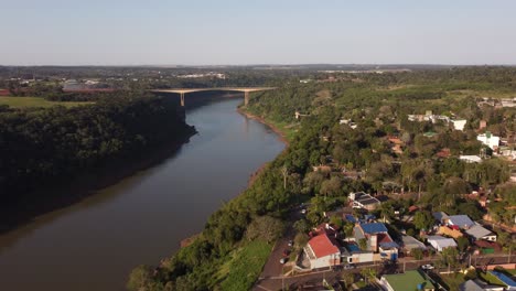 aerial view of iguazu river in misiones with tancredo neves bridge at sunset