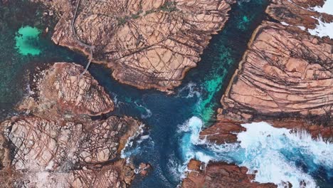 Canal-Rocks-in-Margaret-River,-Western-Australia-at-sunrise-with-water-flowing-through