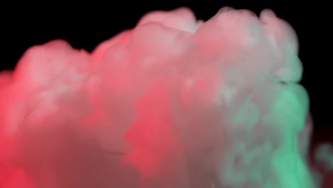 white thick smoke dry ice at black background with red light. close up. slow motion - white thick smoke dry ice at black background with red light at studio, chemical reaction with smoke on dark surface. close up. slow motion