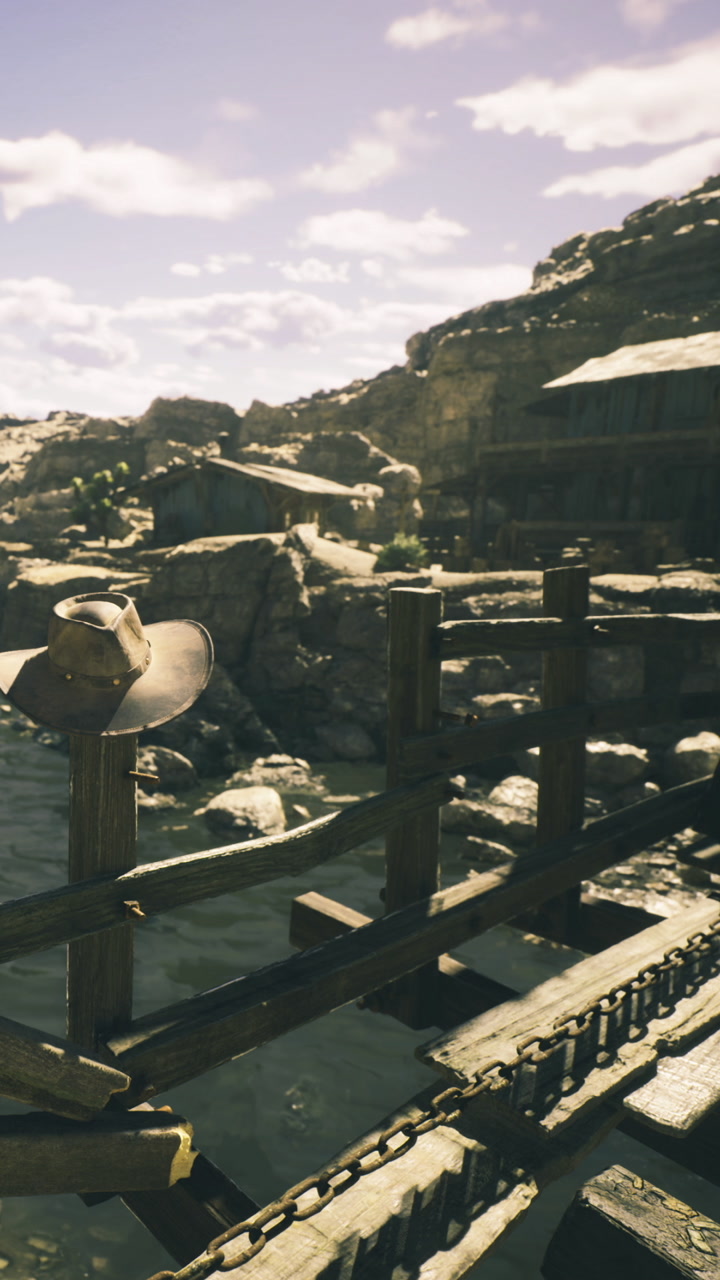 Rustic bridge with a cowboy hat in a serene western landscape at sunset
