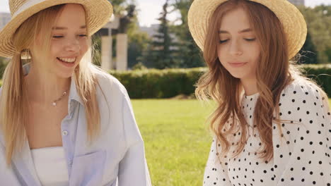 two friends enjoying a summer day in the park