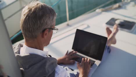 successful senior man businessman using laptop