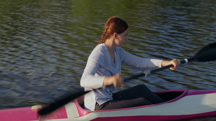Woman kayaking on a lake