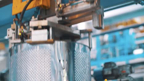 washing machine drums moving on production line at industrial factory