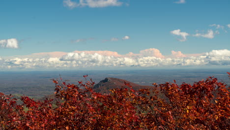 clouds move over a moutain peak