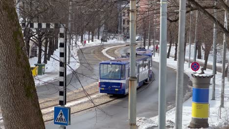 enchanting riga: tram journey amidst snow-covered streets in historic old town