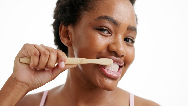 Woman brushing her teeth