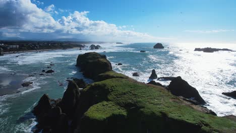 stunning 4k aerial drone shot passing over ocean rock in bandon, oregon