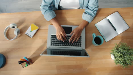 woman working on laptop at desk