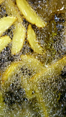 french fries being fried in hot oil