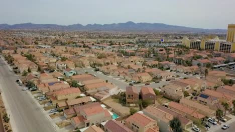 Aerial-flyover-of-residential-neighborhood-with-palm-trees-at-a-diagonal