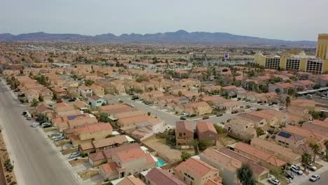 aerial flyover of residential neighborhood with palm trees at a diagonal