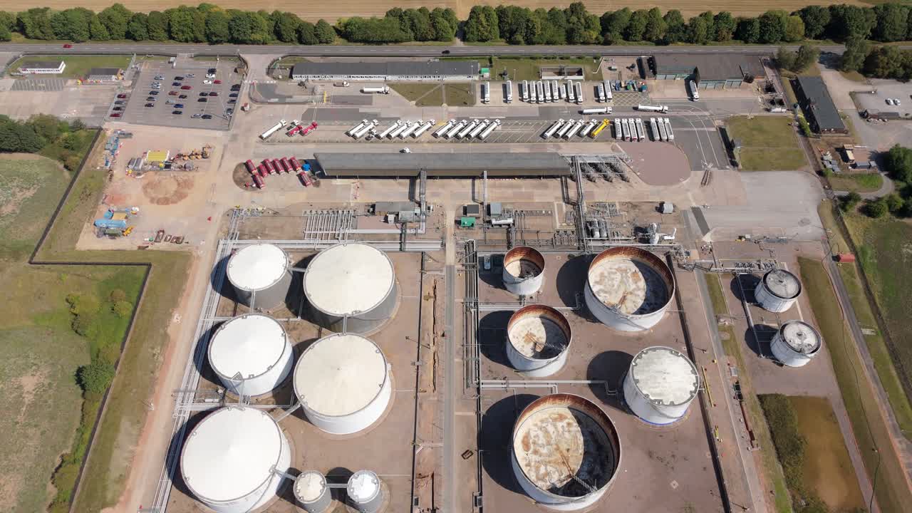Aerial drone footage of Kingsbury chemical plant England UK with fuel silos, petroleum diesel and gas energy park and industrial infrastructure