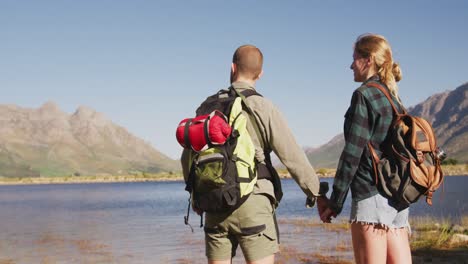 caucasian couple hiking in nature