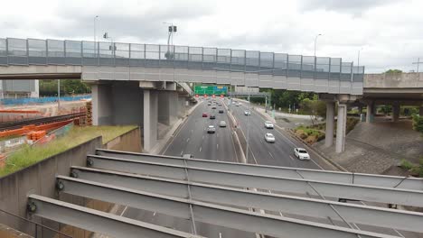 from an overpass looking down on the cars travelling on the duel carriage way of the brisbane inner city bypass