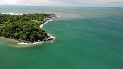 drone shot of an island over the sea