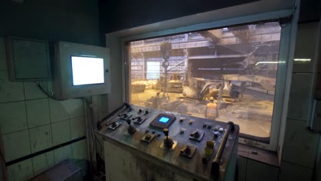 Factory Control Room with Machinery View