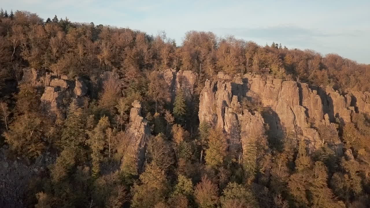 Horizontal pan of the rock formation Battert above the spa town of Baden-Baden in autum at golden hour