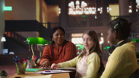 diverse students engaging in conversation in a library setting