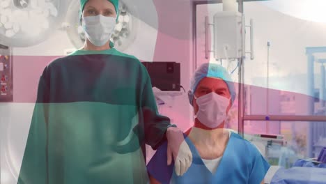 Animation-of-flag-of-england-waving-over-surgeons-in-operating-theatre