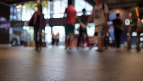 a time lapse of anonymous crowd shoppers inside a modern busy shopping mall complex